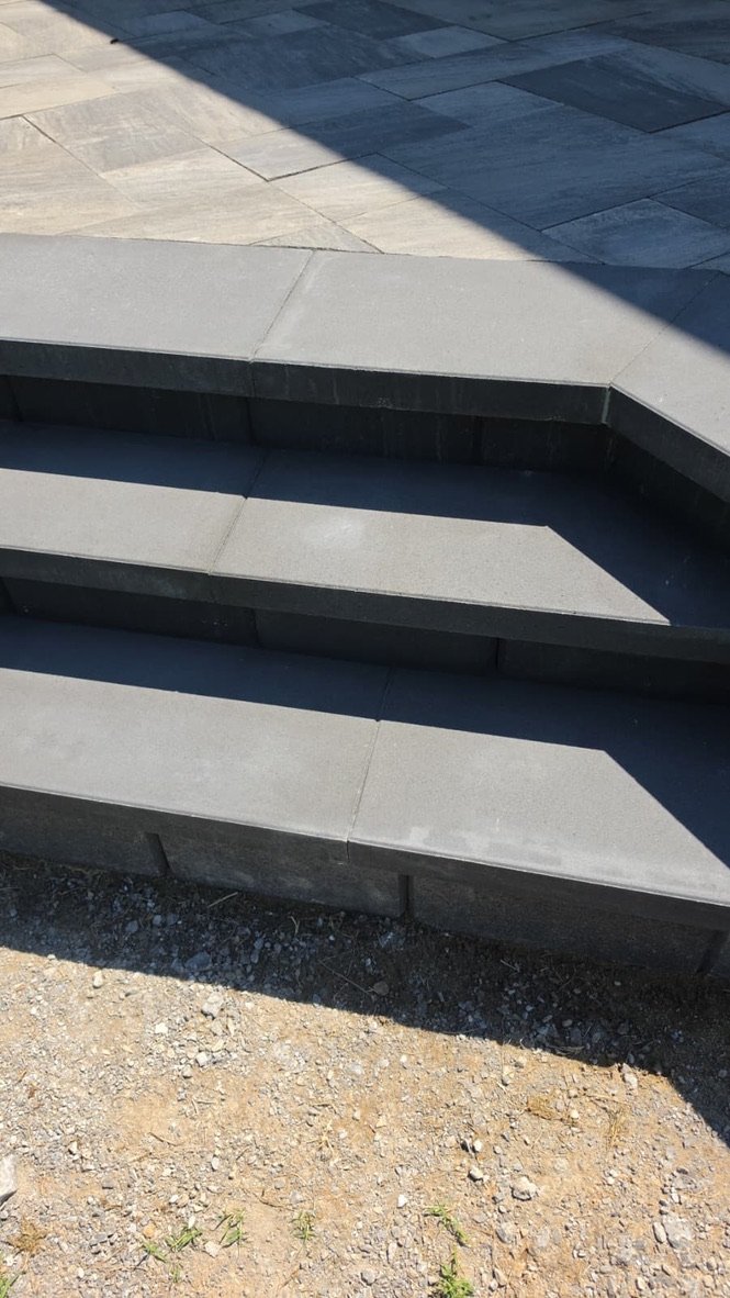 Charcoal paver stairs at an angle.
