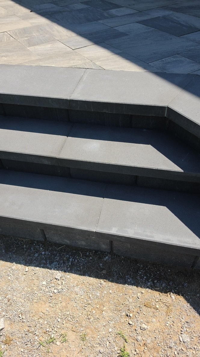 Close view of charcoal paver stairs.