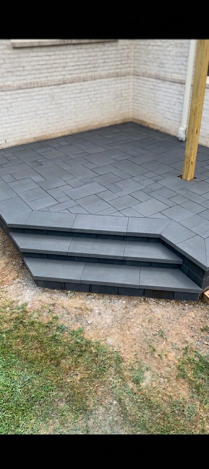 Modular paver patio with a soldier-course border and two wrap-around steps, Private Residence, Hermitage, TN.